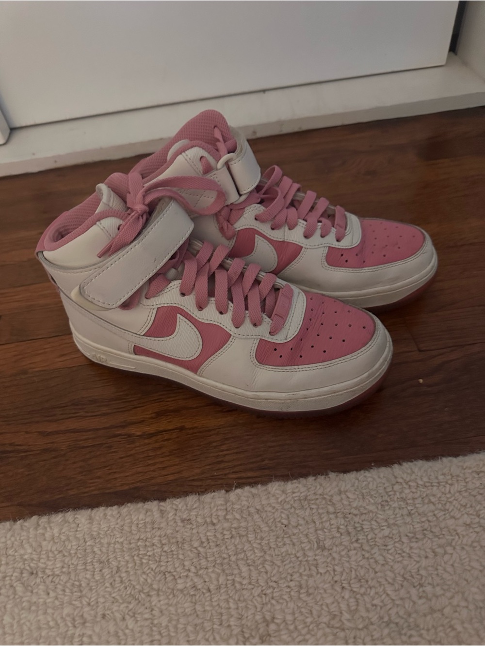 Nike Pink and White High-Top Air Force 1’s